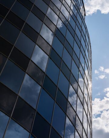 low-angle-view-of-modern-glass-building-facade-in-2025-02-12-18-41-19-utc-scaled