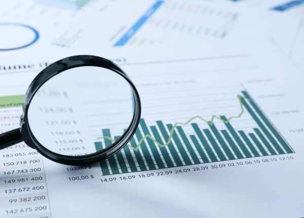 magnifying-glass-and-papers-with-diagrams-space-f-2025-03-24-14-52-43-utc-scaled